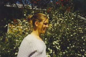 nikki in front of flowers